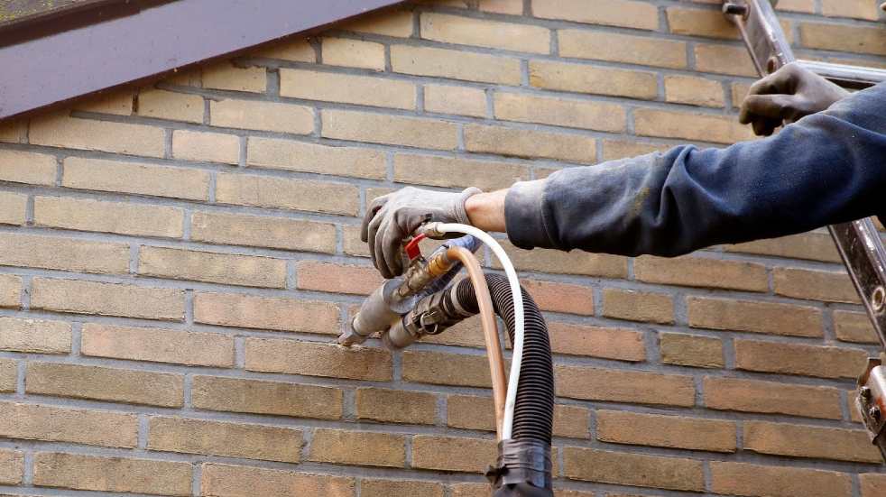 Installing insulation in wall